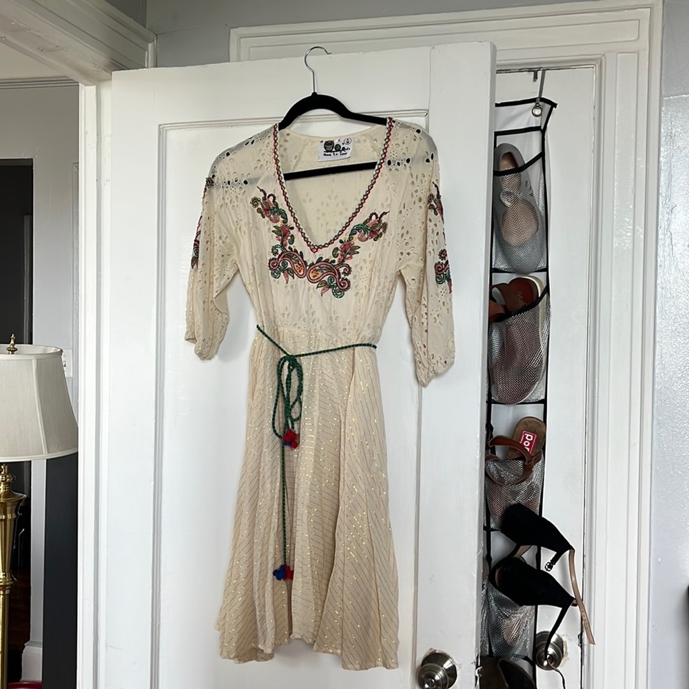 Cream dress with green, red and gold highlights